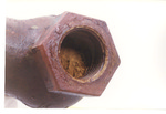 Weapon 07. Pipe end closeup (hexagon) by Cuyahoga County Prosecutor's Office and Cuyahoga County Coroner's Office