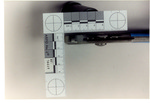 Weapon 17. Closeup of the side of the blue-handled pliers with square ruler by Cuyahoga County Prosecutor's Office and Cuyahoga County Coroner's Office