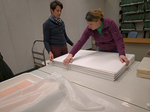 Terri Greer and Jamye Jamison working on the blotter stack by Marsha Miles